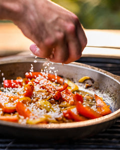 cooking paella on your Nöni stainless steel pan in the Big Green Egg