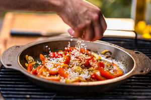 cooking paella on your Nöni stainless steel pan in the Big Green Egg