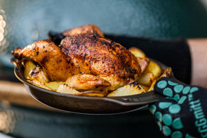 Roast Chicken and potatoes in a cooking paella on your Nöni stainless steel pan in the Big Green Egg